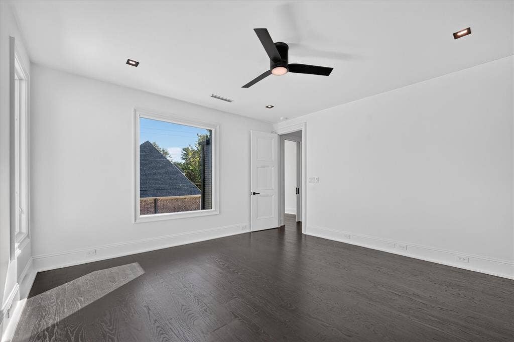 6404 Lakehurst Avenue, Dallas, TX 75230 Dark wood-finish flooring with white baseboards, recessed lighting, and a contemporary ceiling fan