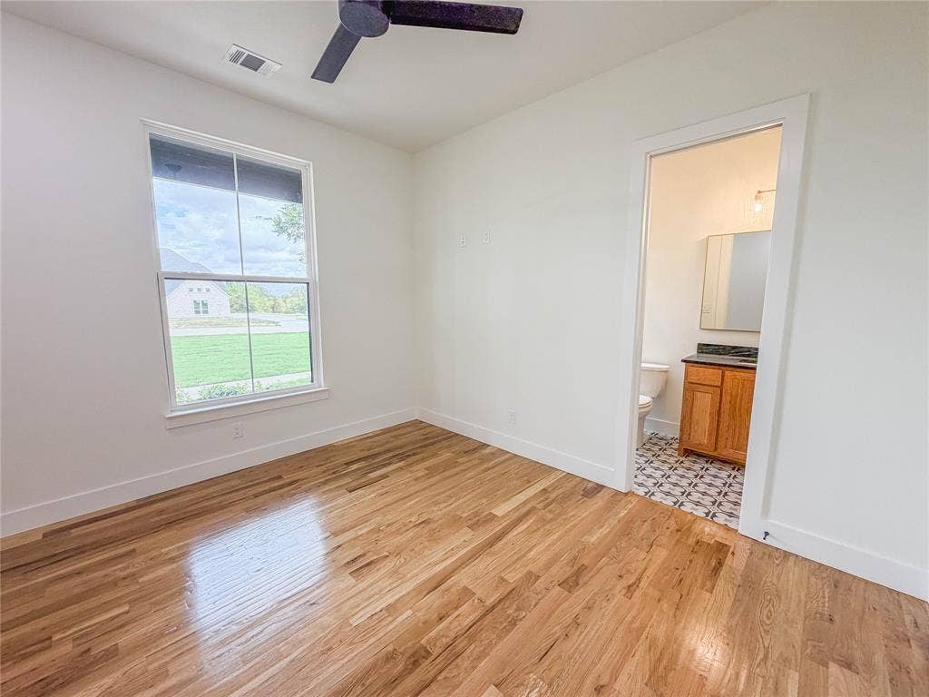 3860 Jacks Loop, Midlothian, TX 76065 Wood flooring, ceiling fan, single window, bathroom access, white walls