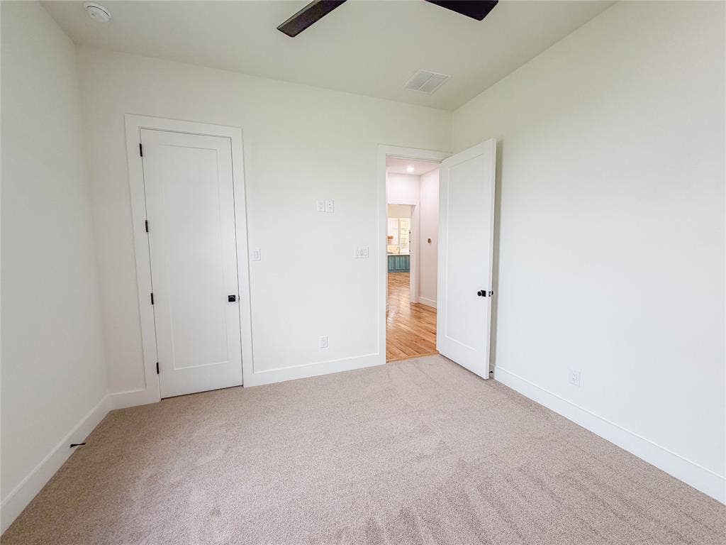 3860 Jacks Loop, Midlothian, TX 76065 Neutral-toned carpet flooring, white walls, and white trim