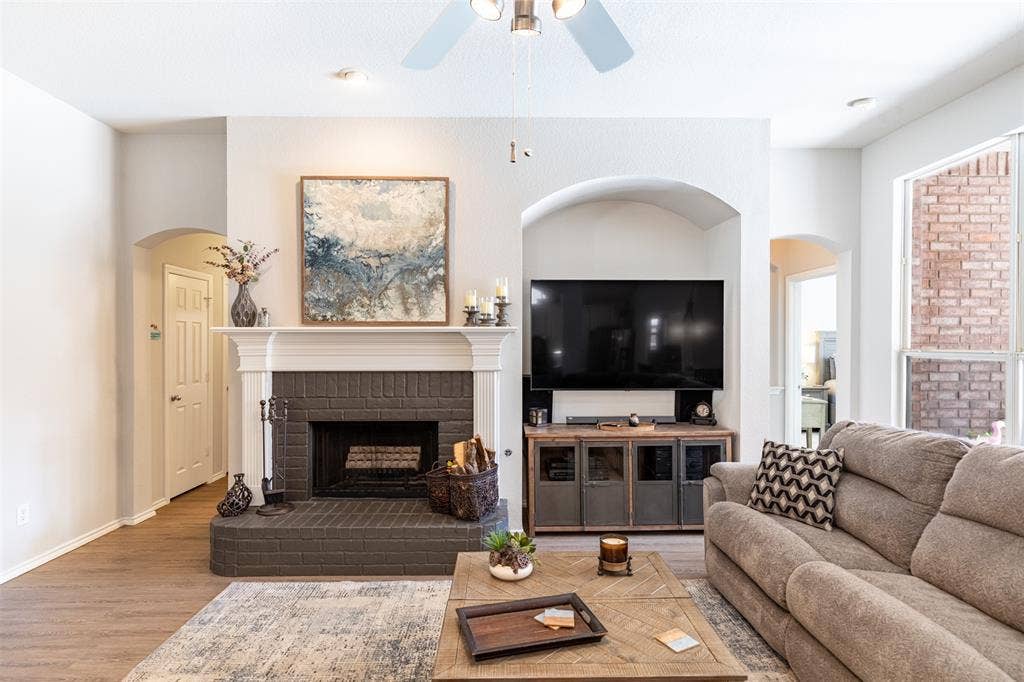 Living room anchored by a cozy fireplace.