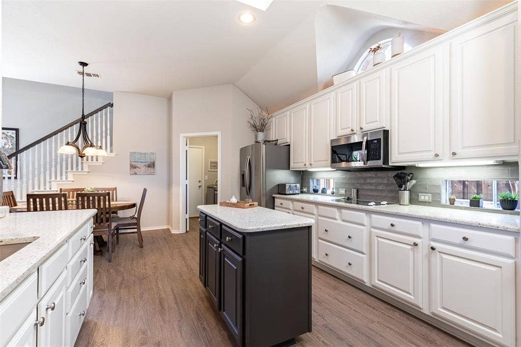 Open-concept kitchen to breakfast room.