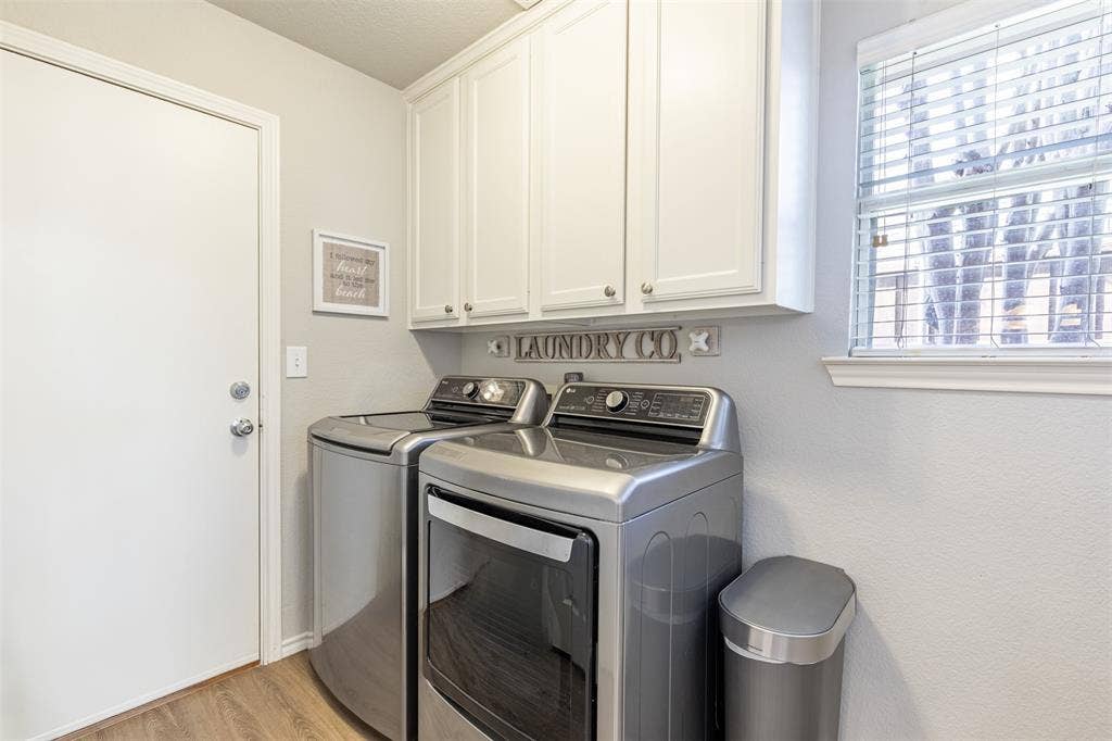 Laundry room with built-ins & a walk-in storage closet.