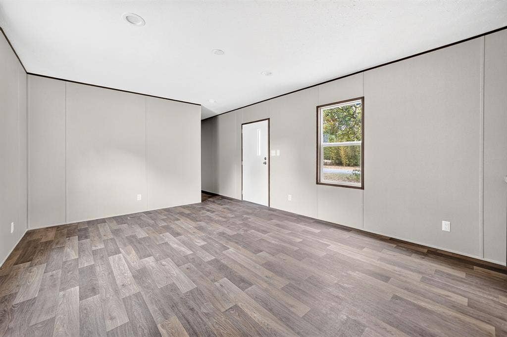 216 W Acres Road, Gun Barrel City, TX 75156 Spacious interior featuring wood-finish flooring, recessed lighting, and a neutral color palette
