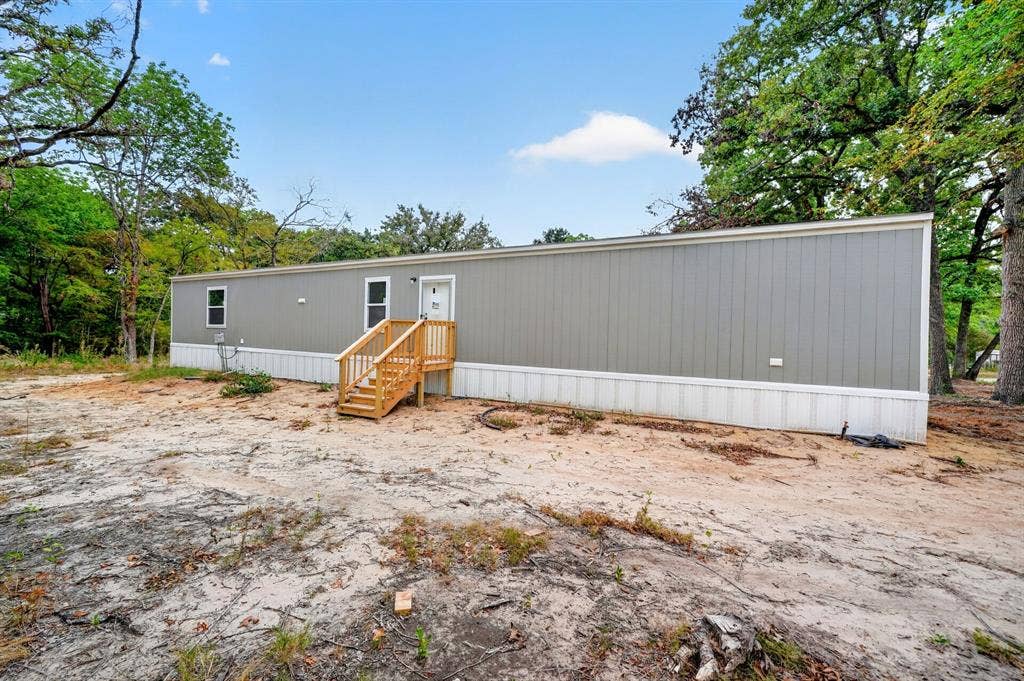 216 W Acres Road, Gun Barrel City, TX 75156 Gray siding exterior with white trim