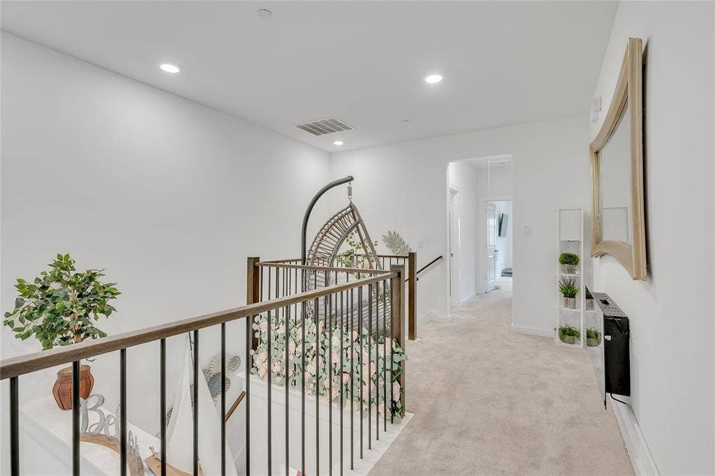 525 Division Street, Plano, TX 75075 Hallway featuring light-colored carpeting, recessed lighting, and a wood-toned railing with black balusters