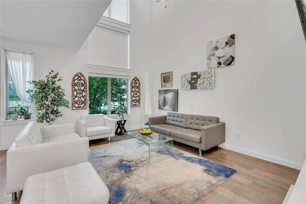 525 Division Street, Plano, TX 75075 Two-story ceiling, tall windows, wood-finish flooring, and crisp white walls