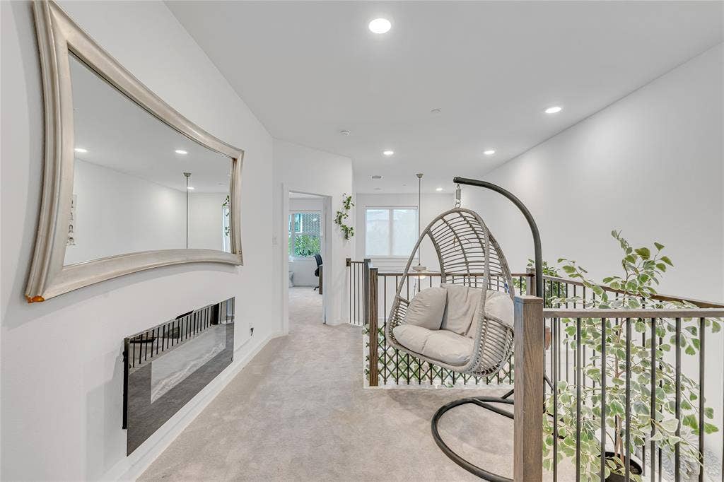 525 Division Street, Plano, TX 75075 Recessed lighting, light gray carpeting, and a built-in wall-mounted fireplace