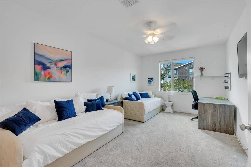 525 Division Street, Plano, TX 75075 Recessed lighting, ceiling fan, expansive window, built-in shelving, and light gray carpeting