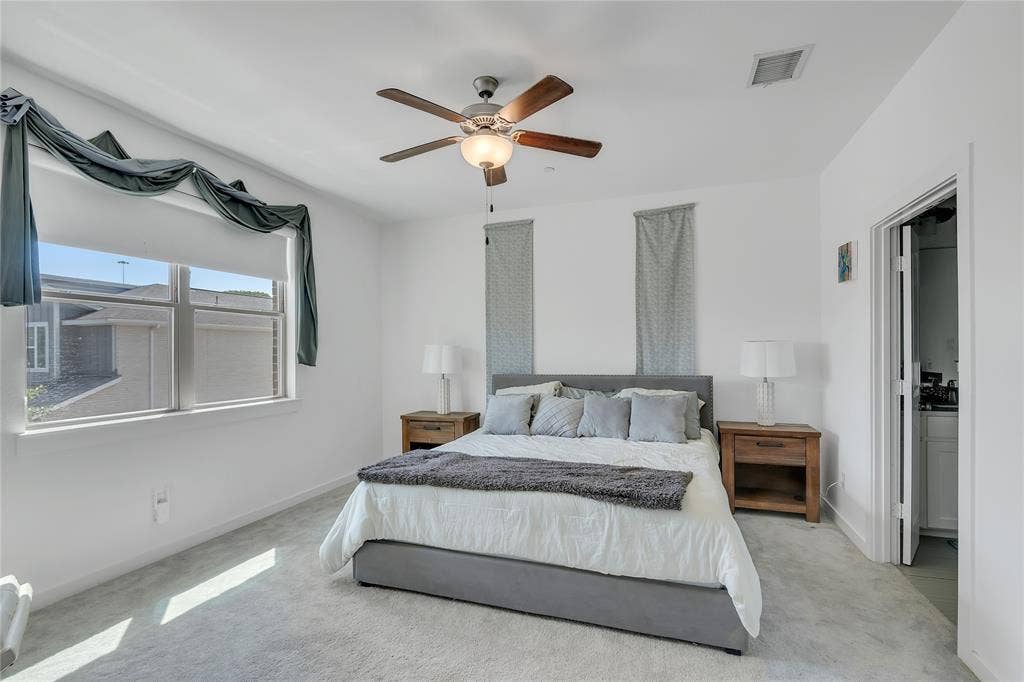 525 Division Street, Plano, TX 75075 Plush carpeting, a modern ceiling fan, and a light-filled window