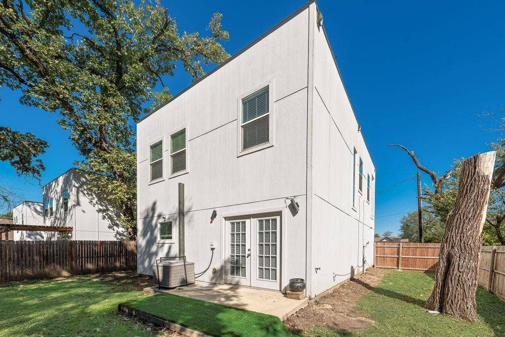 White siding exterior with multiple windows
