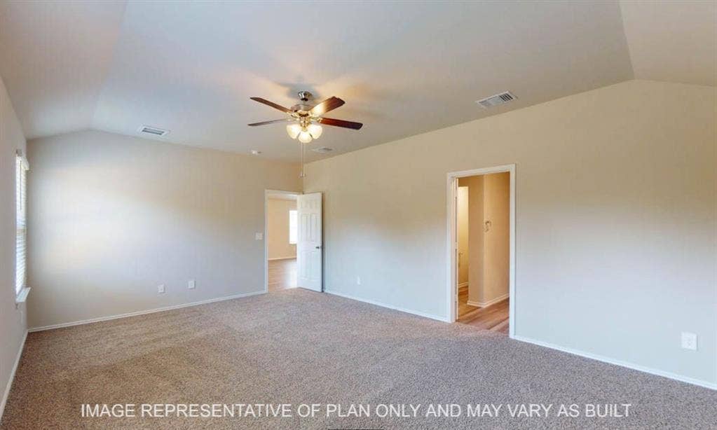 10220 Altair Drive, Waco, TX 76708 Vaulted ceiling with an attached ceiling fan, neutral carpet flooring, and a window for natural light