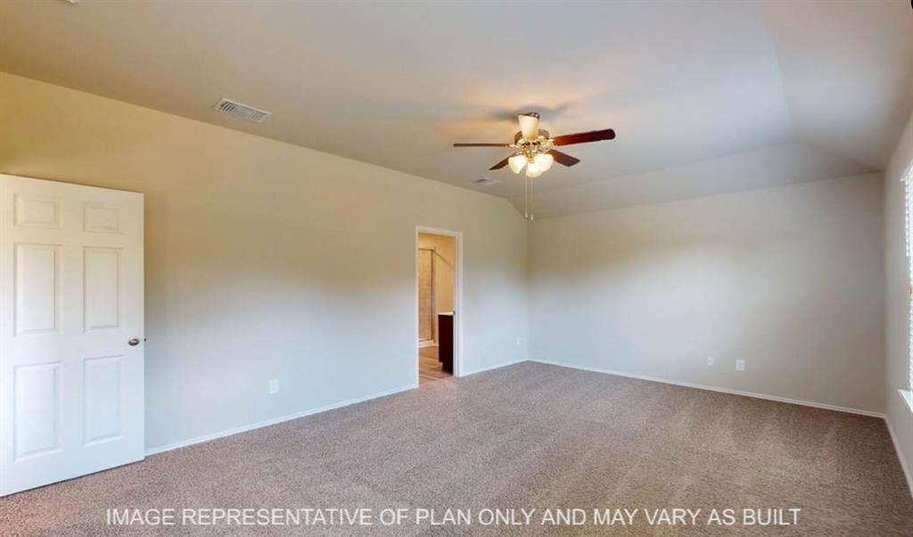 10220 Altair Drive, Waco, TX 76708 Carpeted flooring, vaulted ceiling, ceiling fan with integrated lighting, paneled interior door, and window