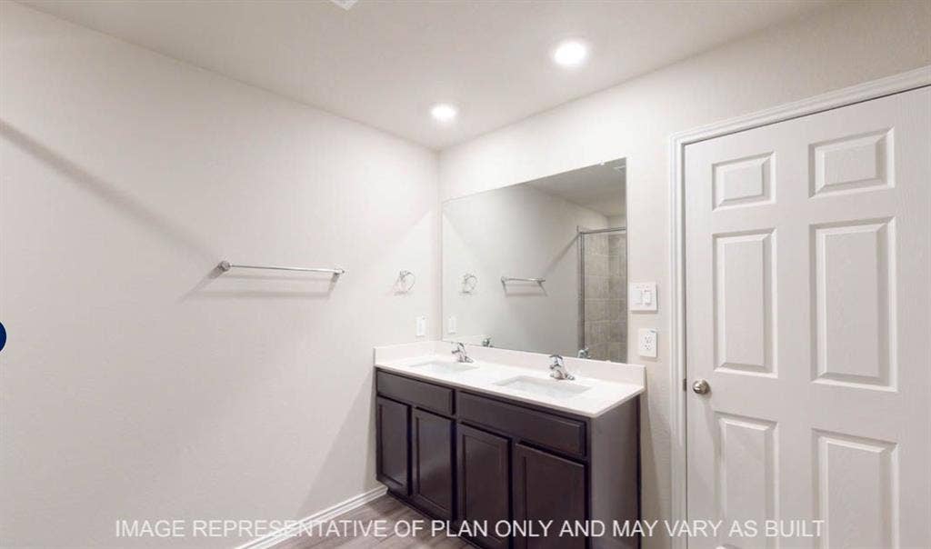 10220 Altair Drive, Waco, TX 76708 Dual vanity with undermount sinks, chrome faucets, and a full-width mirror