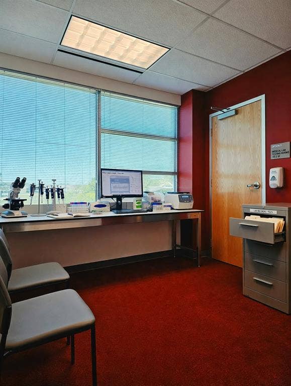 1675 Republic Parkway, #150 and 5 Offices, Mesquite, TX 75150 Recessed ceiling lighting, large windows with horizontal blinds, red wall finish, wood-finish door, and red carpet flooring