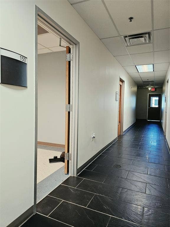 1675 Republic Parkway, #150 and 5 Offices, Mesquite, TX 75150 Black rectangular tile flooring throughout the hallway