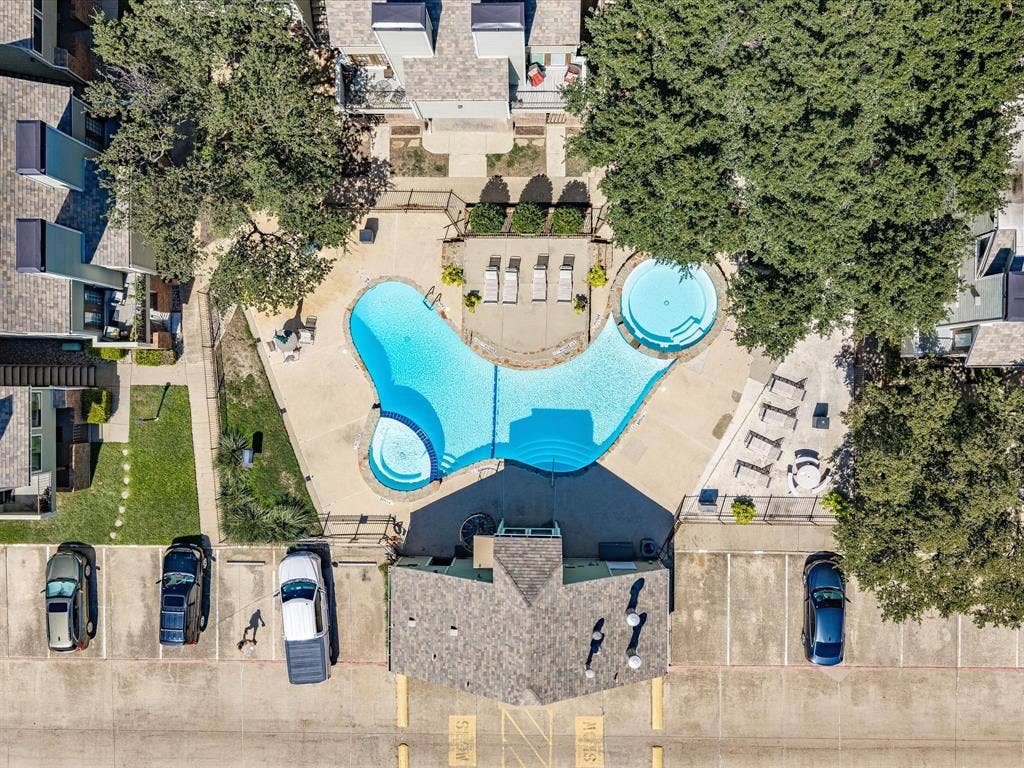 3129 Sondra Drive, #206, Fort Worth, TX 76107 Expansive common area featuring a multi-level swimming pool, integrated spa, and shaded lounging areas