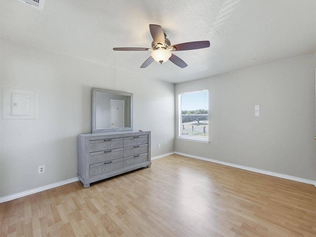 3129 Sondra Drive, #206, Fort Worth, TX 76107 Wood-finish flooring with a neutral color palette