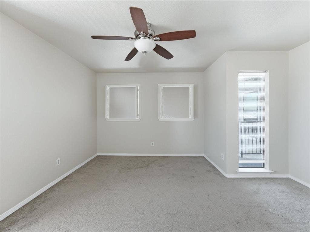 3129 Sondra Drive, #206, Fort Worth, TX 76107 Recessed windows, ceiling fan with light fixture, and carpeted flooring
