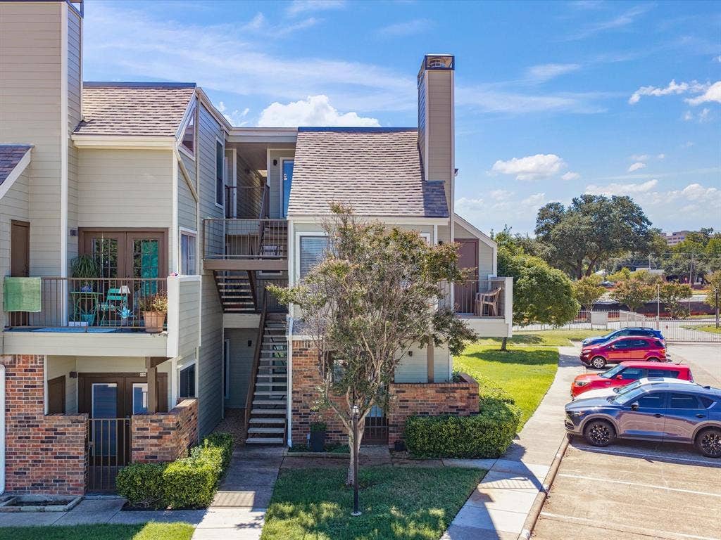 3129 Sondra Drive, #206, Fort Worth, TX 76107 Multi-story building featuring light green siding and brick accents