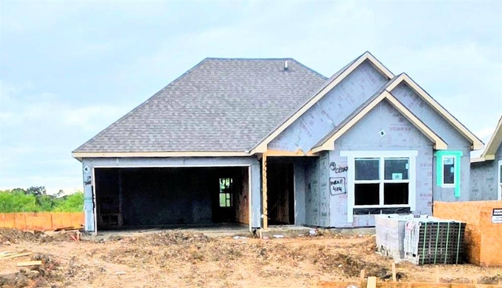 10108 Altair Drive, Waco, TX 76708 New construction residence featuring a composition shingle roof, attached two-car garage, and multiple windows
