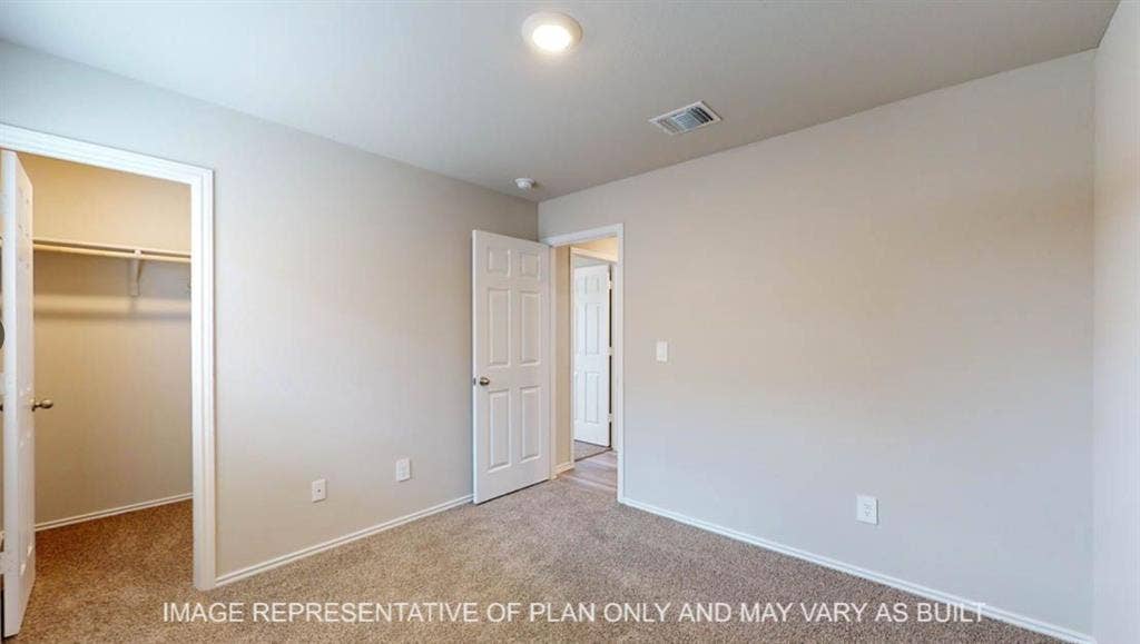 10108 Altair Drive, Waco, TX 76708 Neutral tone wall paint, carpet flooring, overhead lighting, and white interior doors