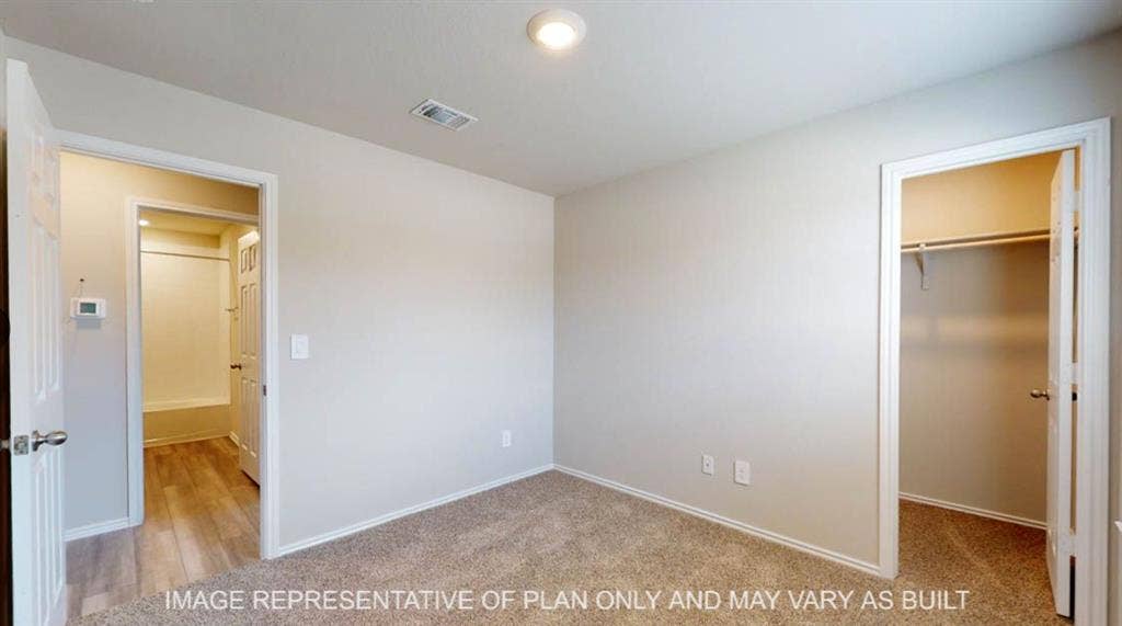 10108 Altair Drive, Waco, TX 76708 Neutral wall paint, recessed lighting, carpet flooring, and a built-in closet with shelving