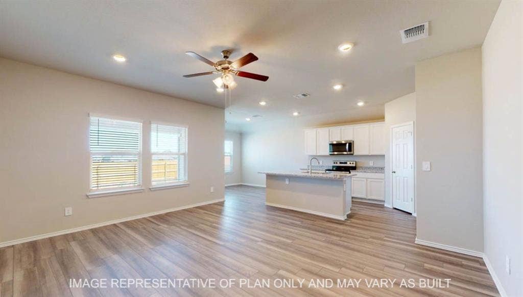 10108 Altair Drive, Waco, TX 76708 Open-concept living space featuring wood-finish flooring, recessed lighting, and a ceiling fan