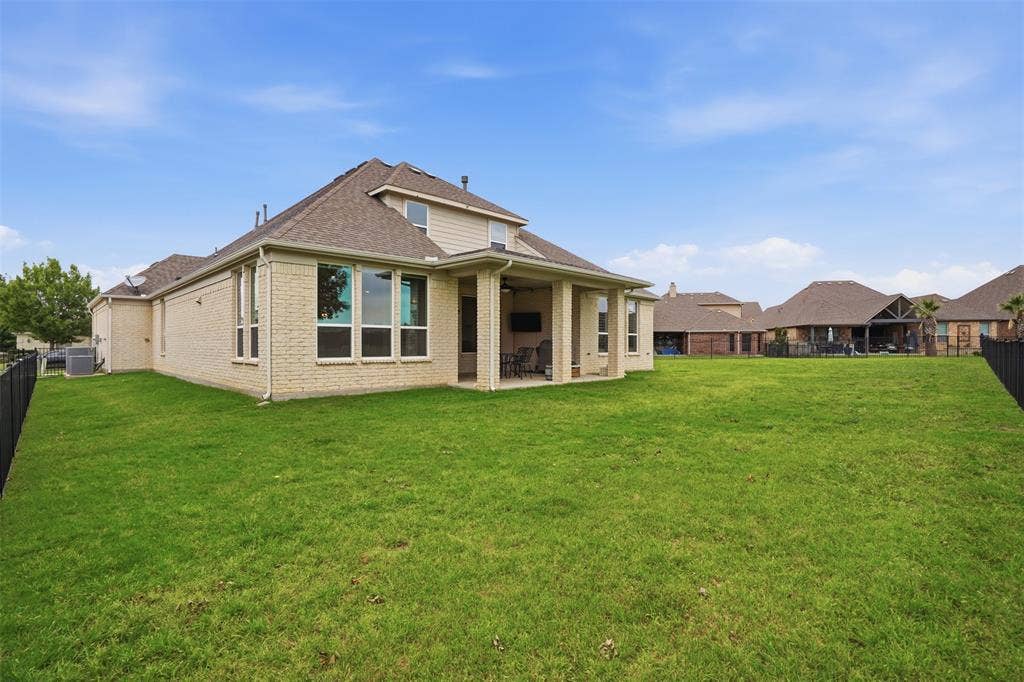 Large yard overlooking the golf course