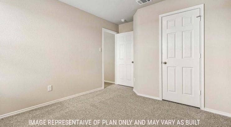10101 Altair Drive, Waco, TX 76708 Neutral-toned walls, textured carpeting, and white six-panel doors