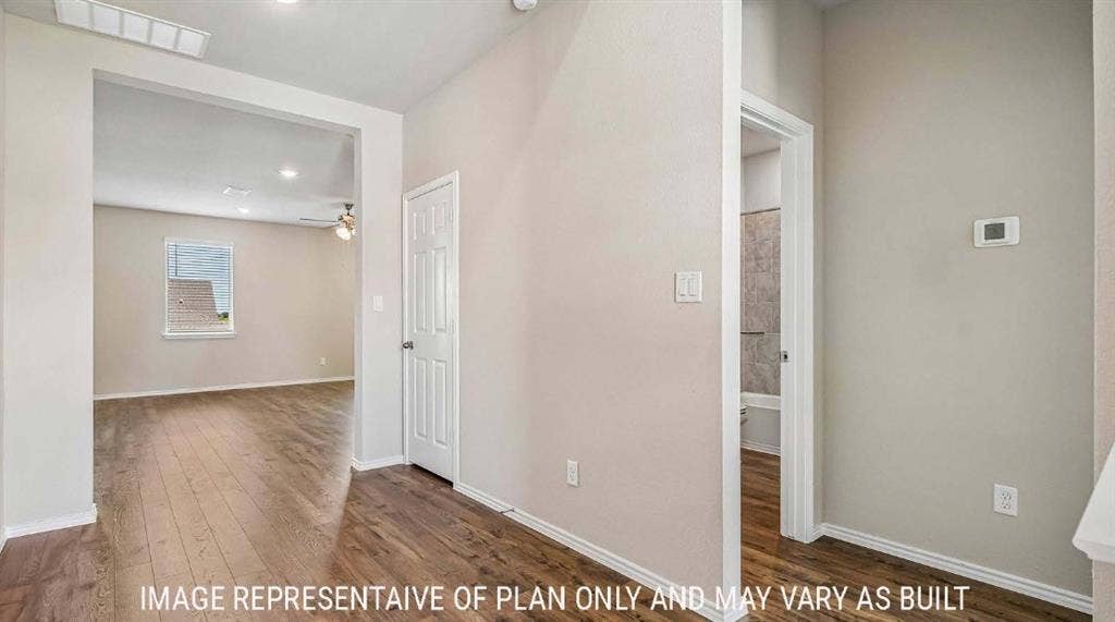 10101 Altair Drive, Waco, TX 76708 Wood-finish flooring throughout, light-toned wall paint, recessed lighting, and a paneled interior door