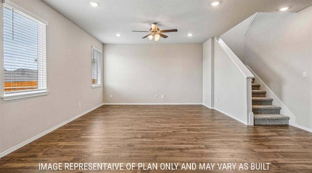 10101 Altair Drive, Waco, TX 76708 Wood-finish flooring, recessed lighting, ceiling fan, and a carpeted staircase