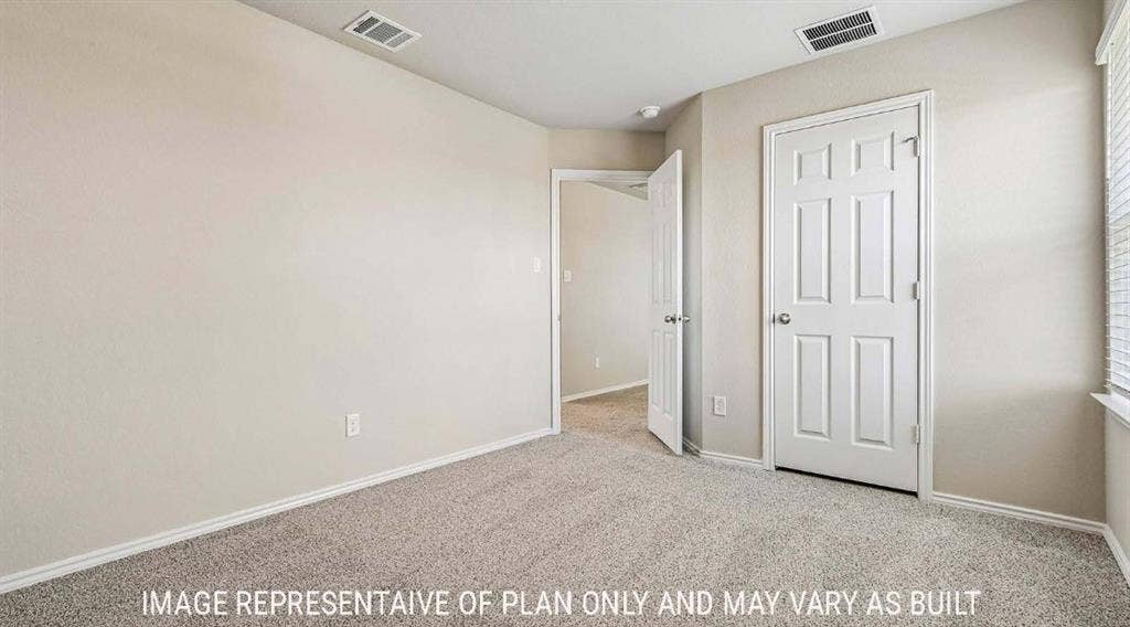 10101 Altair Drive, Waco, TX 76708 Wall-to-wall carpet, interior paneled doors, and light-toned wall finishes