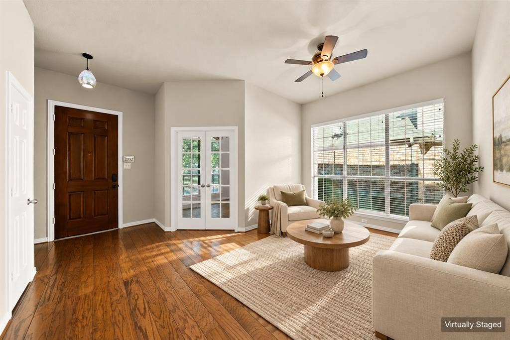 242 Cox Drive, Fate, TX 75087 Wood-finish flooring, white French doors, expansive window with blinds, ceiling fan, and recessed lighting