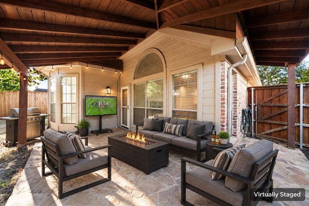 242 Cox Drive, Fate, TX 75087 Covered outdoor patio featuring a wood ceiling and string lights