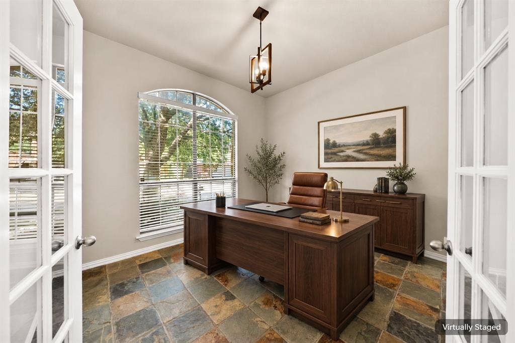 242 Cox Drive, Fate, TX 75087 French doors with glass panels, arched window with blinds, multi-toned slate tile flooring, and a central ceiling light fixture
