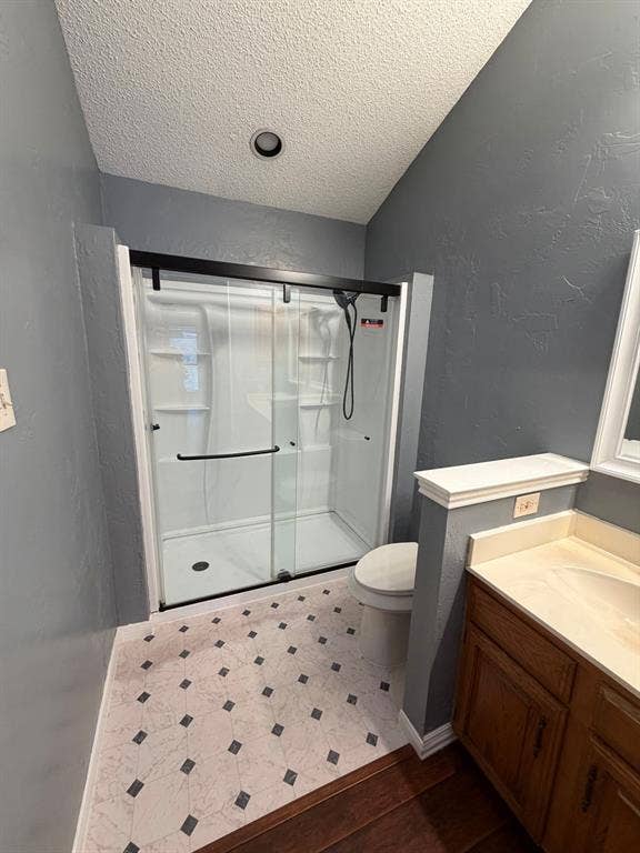 2200 W Park Boulevard, #1003, Plano, TX 75075 Walk-in shower with sliding glass door upstairs ensuite primary bedroom