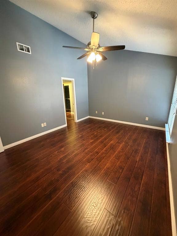 2200 W Park Boulevard, #1003, Plano, TX 75075 Vaulted ceilings, primary bedroom upstairs wood-finish flooring, and a central ceiling fan with integrated light fixture