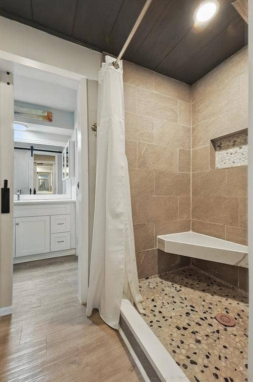 5247 Fm 1569, Farmersville, TX 75442 Tiled shower with a corner bench, pebble flooring, and built-in niche