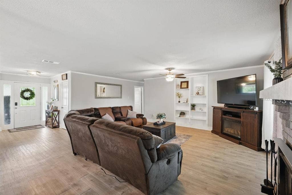 5247 Fm 1569, Farmersville, TX 75442 Wood-finish flooring, white trim, recessed lighting, ceiling fan, and built-in shelving