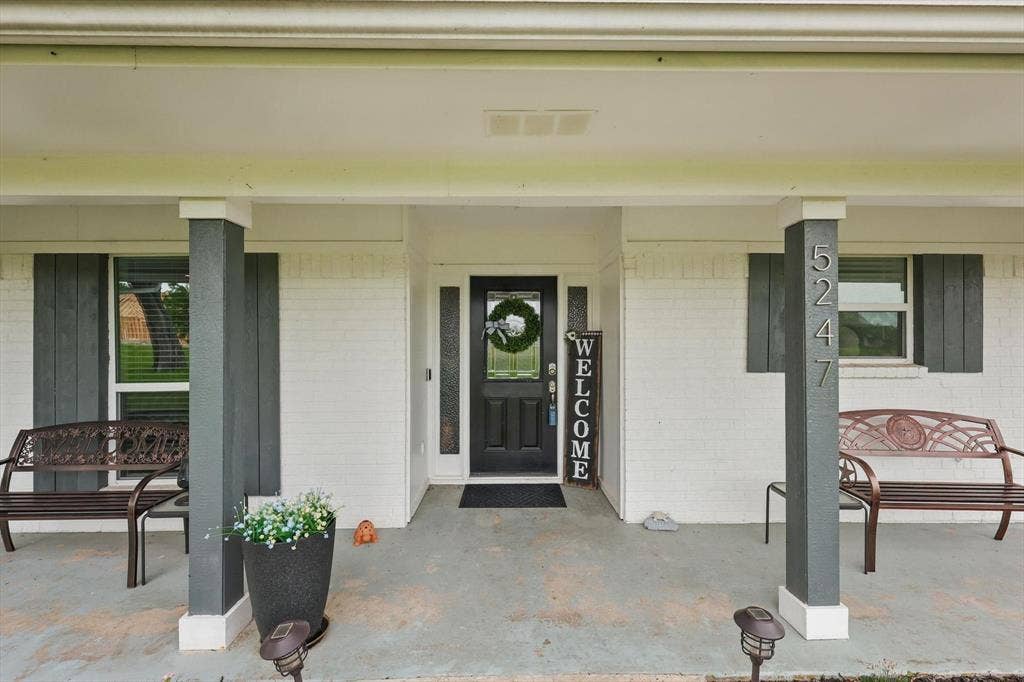 5247 Fm 1569, Farmersville, TX 75442 Brick facade with painted shutters, covered entry porch, and glass panel entry door
