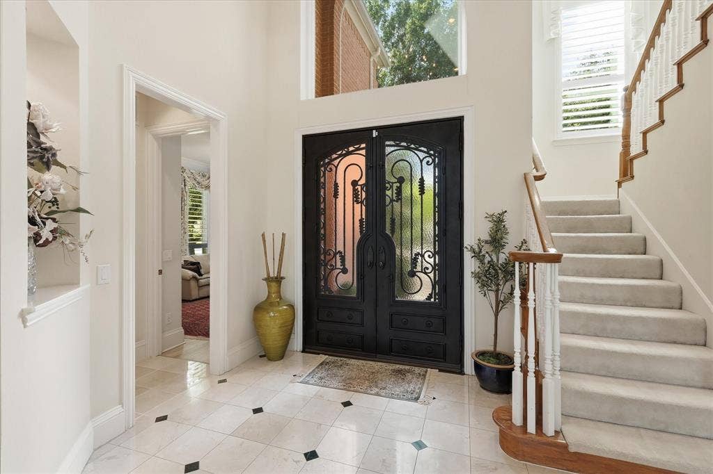 2122 Clearspring Drive N, Irving, TX 75063 Double wood & iron doors lead into the foyer