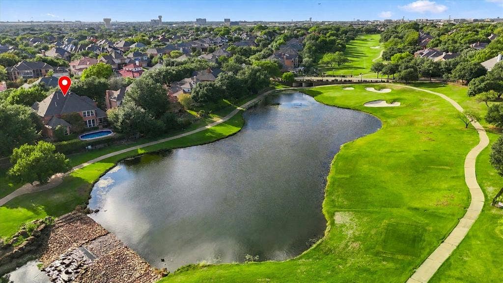 2122 Clearspring Drive N, Irving, TX 75063 Located on the 11th hole with picturesque views of the water