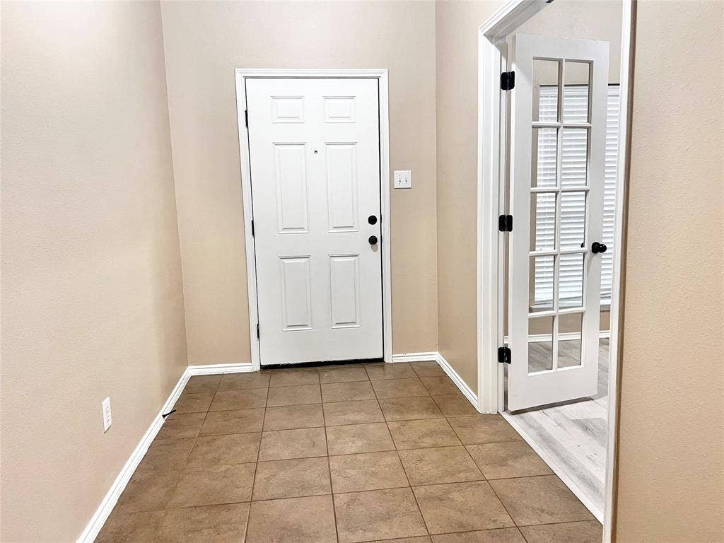 5204 Bear Valley Drive, McKinney, TX 75071 Tile flooring, paneled entry door, French doors, wood-finish flooring