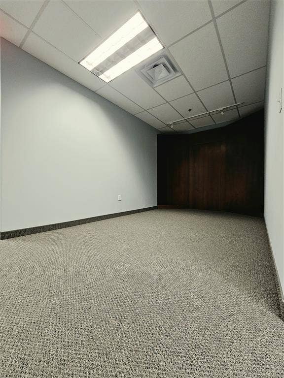 1675 Republic Parkway, #201B, Mesquite, TX 75150 Recessed fluorescent lighting, acoustical tile ceiling, light gray walls, dark wood-finish paneling, and wall-to-wall carpeting