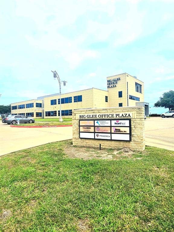 1675 Republic Parkway, #201B, Mesquite, TX 75150 Brick facade office building featuring multiple windows and a prominent exterior sign