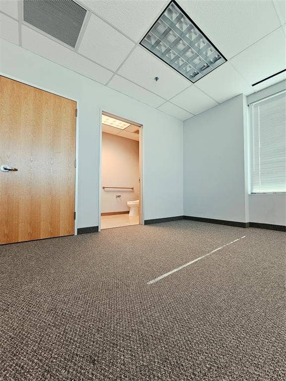 1675 Republic Parkway, #201B, Mesquite, TX 75150 Textured carpet flooring, white walls, and a suspended ceiling with recessed lighting