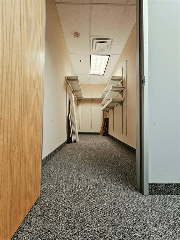1675 Republic Parkway, #201B, Mesquite, TX 75150 Recessed lighting, acoustic ceiling tiles, light wood-finish door, carpet flooring, wall-mounted shelving brackets