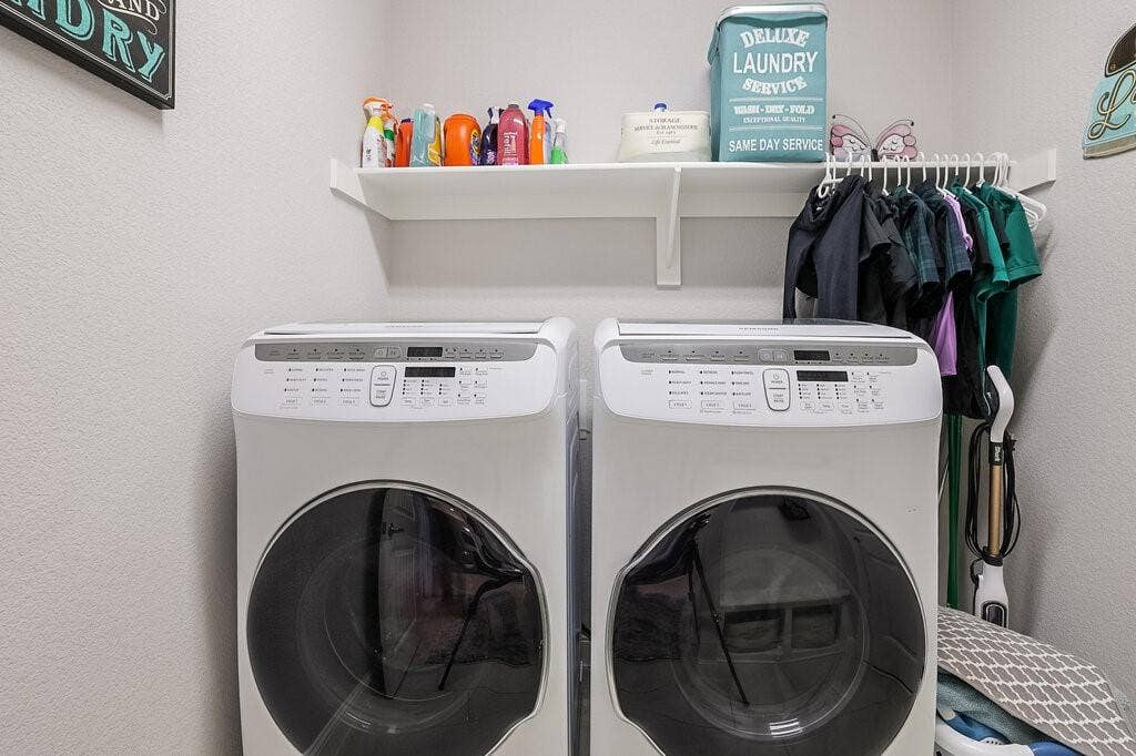 Front-loading washing machine and dryer set with an overhead shelf