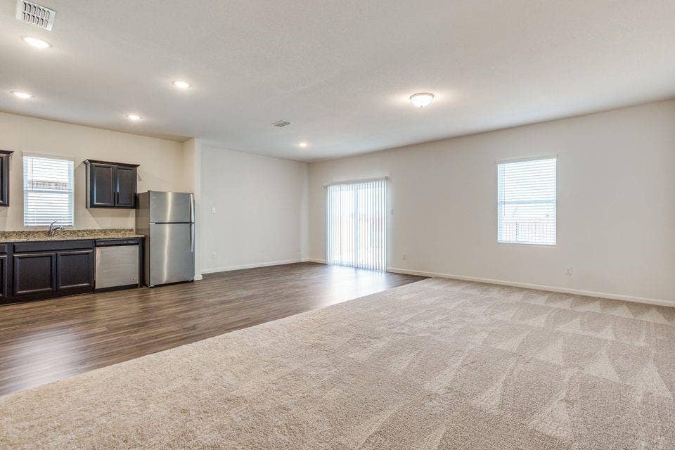 212 Briar Cove, Anna, TX 75409 Open-concept living space featuring wood-finish flooring, recessed lighting, and a sliding glass door