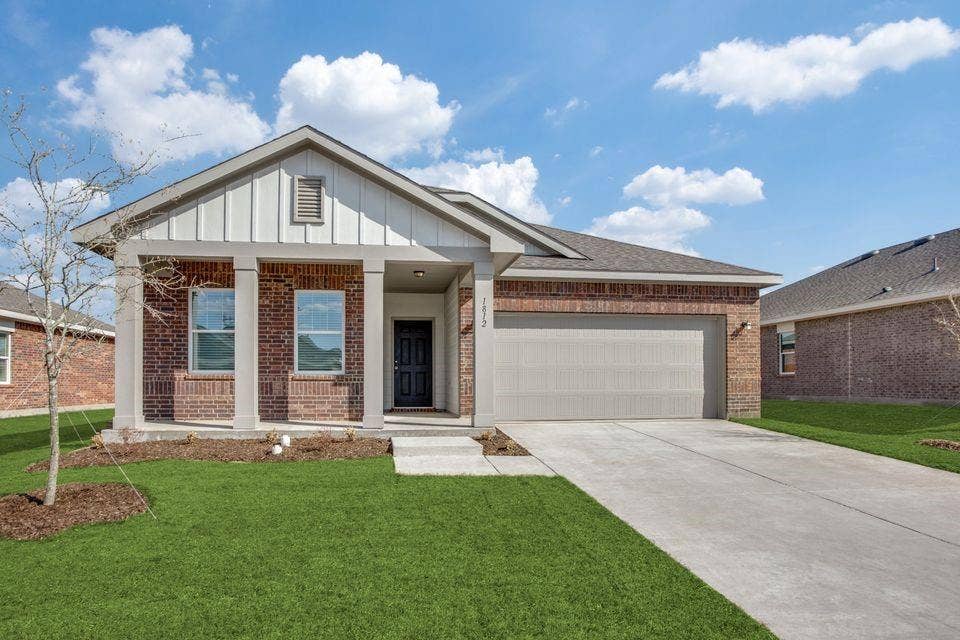 212 Briar Cove, Anna, TX 75409 Brick exterior with vertical siding accents, covered entry, and an attached two-car garage